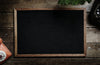 Black Picture Frame on Vintage Wooden Table Photo Mockup