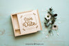Wooden Box Mockup Next To Flowers Psd