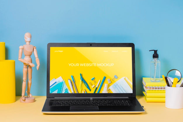 Wooden Mannequin And Laptop With Mock-Up Psd