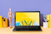 Wooden Mannequin And Laptop With Mock-Up Psd