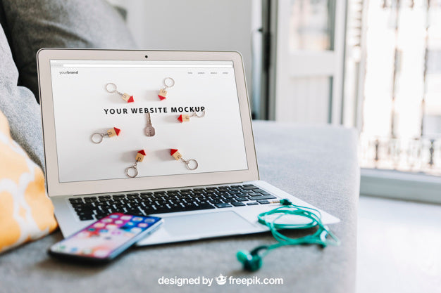 Workspace Composition With Smartphone On Laptop Psd