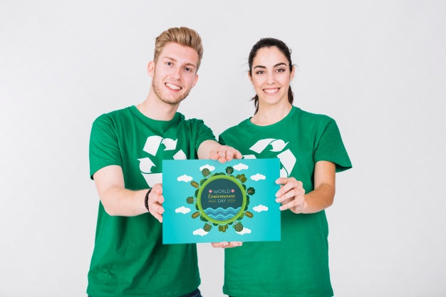 World Environment Day Mockup With Volunteer Couple Holding Paper Psd