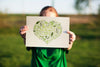 World Environment Day Mockup With Volunteer Holding Paper Psd