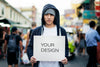 Young Asian Man Holding Empty Placard Outdoors Psd