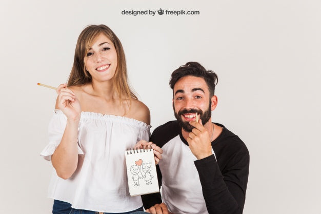 Young Couple Holding Notepad Psd