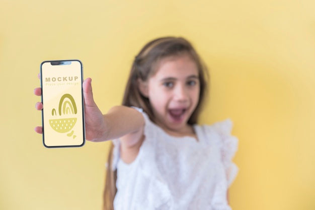 Young Girl Holding Phone With Mock-Up Psd