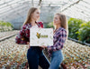 Young Girls Holding A Farm Sign Psd