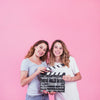 Young Girls Holding Clapperboard Psd