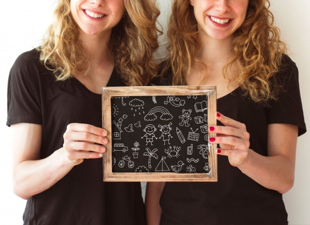 Young Girls Holding Slate Mockup Psd