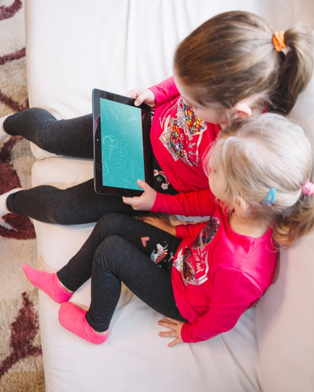 Young Girls Using Tablet Psd