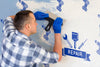 Young Handyman Cleaning The Wall Psd