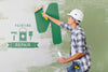 Young Handyman Painting The Wall In Green Psd