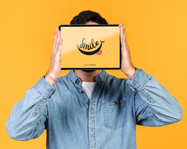 Young Man Covering His Face With A Tablet Mock Up Psd