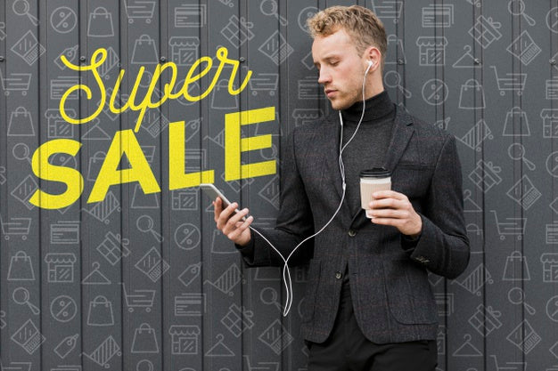 Young Man Holding Cup Of Coffee And Looking At Mobile Psd