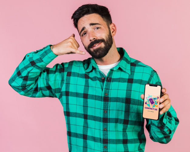 Young Man Pretending Speaking At Phone And Holding A Cell Phone Mock Up Psd