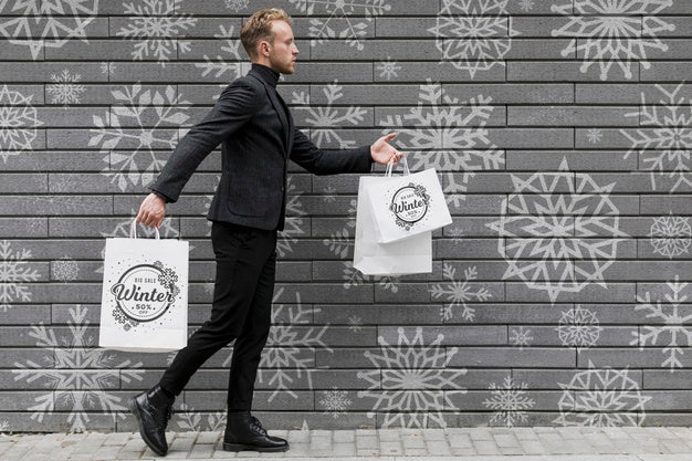 Young Man Walking With Shopping Bags Psd