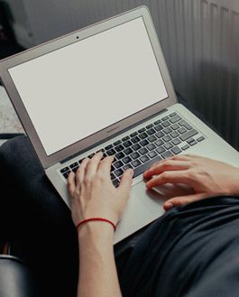 Young Man Working On His Macbook Air