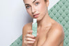 Young Woman Holding A Skincare Product Mock-Up Psd