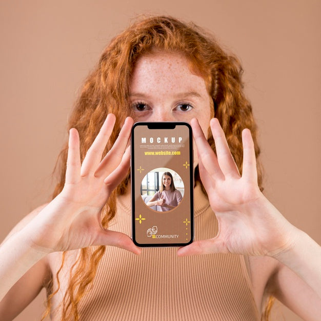 Young Woman Holding A Smartphone Mock-Up Psd