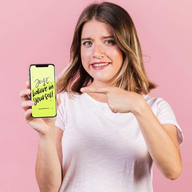 Young Woman Pointing Finger At A Cellphone Mock-Up Psd