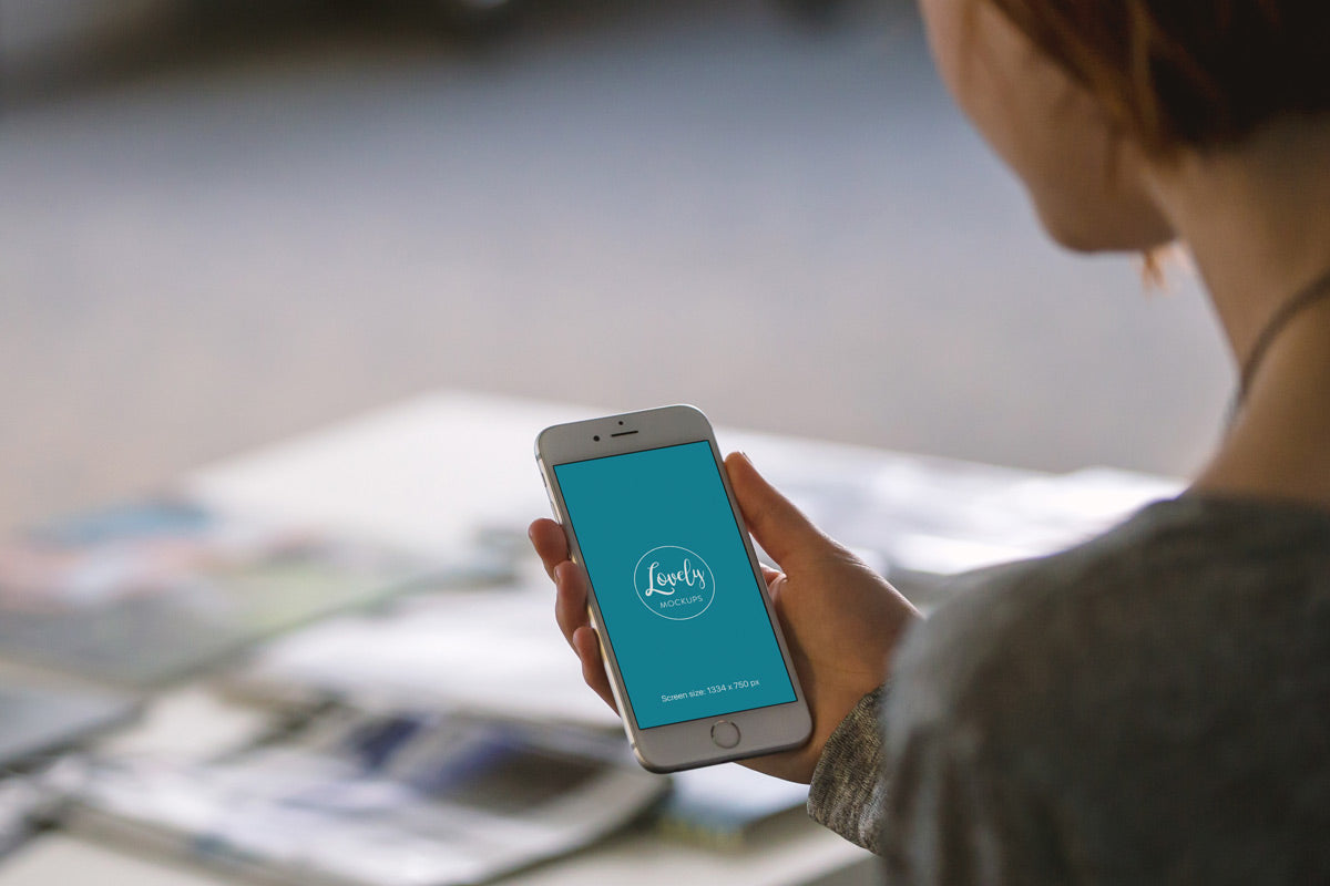 Young Woman Holding White iPhone 7