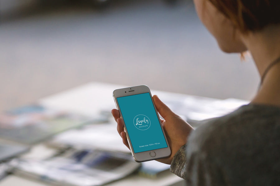 Young Woman Holding White iPhone 7